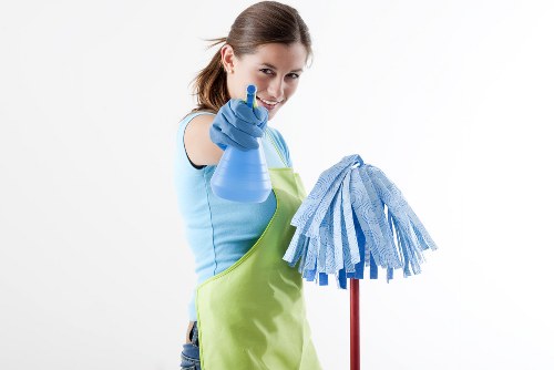 Professional carpet cleaner assessing a home carpet in NW8